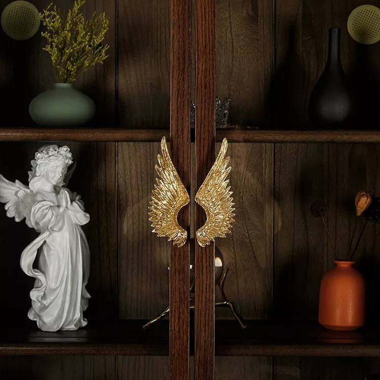 A pair of Large Gold Brass Angel Wing Cabinet Pulls/Feathery wing Door Handles/wardrobe handles/large drawer handle/big statement handles