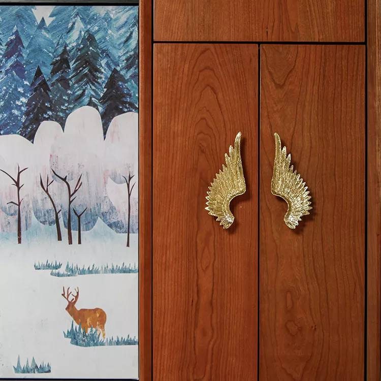 A pair of Large Gold Brass Angel Wing Cabinet Pulls/Feathery wing Door Handles/wardrobe handles/large drawer handle/big statement handles