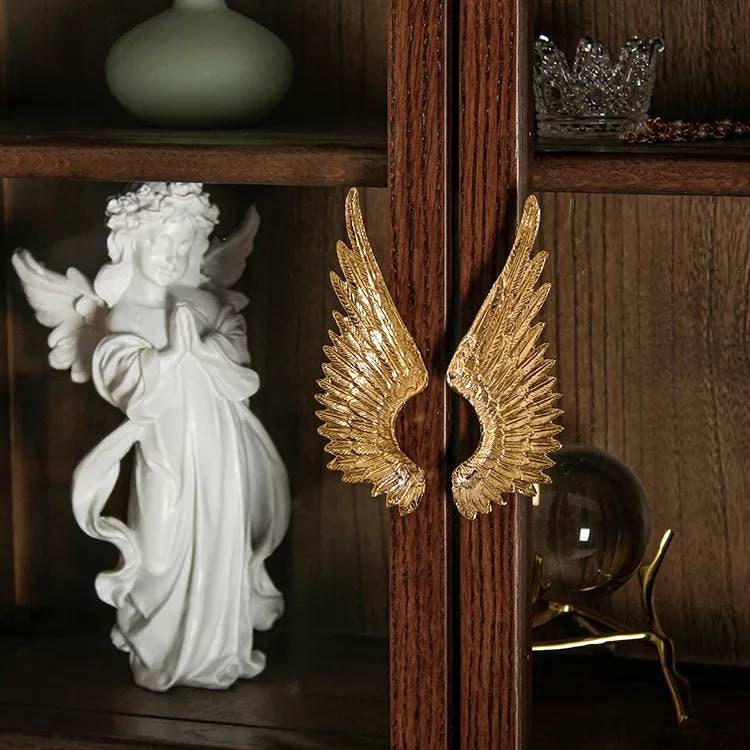 A pair of Large Gold Brass Angel Wing Cabinet Pulls/Feathery wing Door Handles/wardrobe handles/large drawer handle/big statement handles